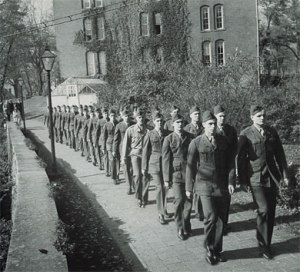 Column of marching soldiers on college campus (from Google images)
